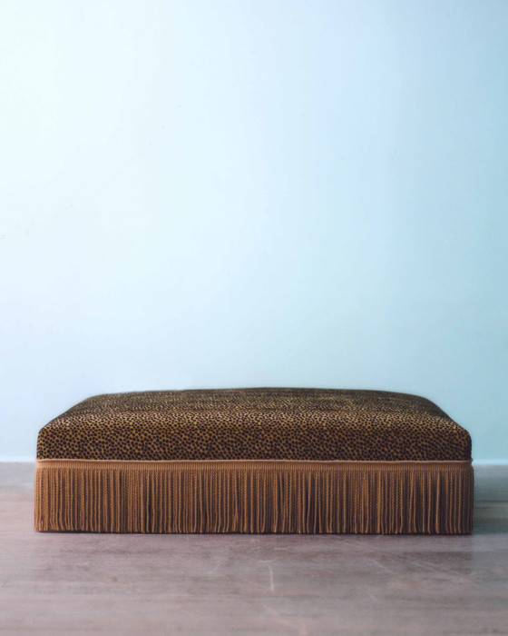 UPHOLSTERED OTTOMAN (CHEETAH), 2023